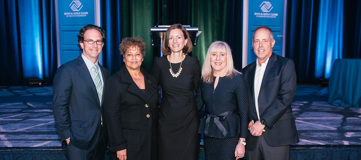 Bozzuto Chairman Toby Bozzuto posing with the representatives of The Boys and Girls Clubs of Greater Washington.