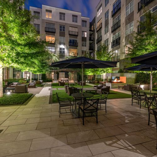 Lush landscaping, grilling and dining areas with social spaces for gathering