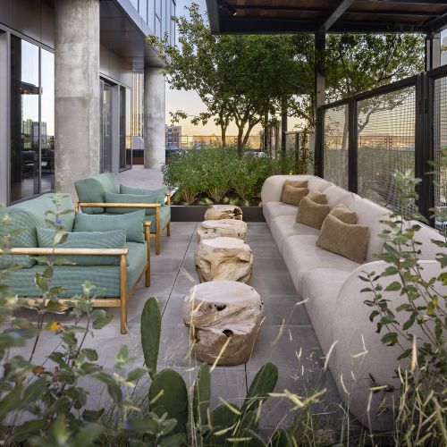 Relax on the rooftop deck while listening to live music from the neighboring Bridgestone Arena 