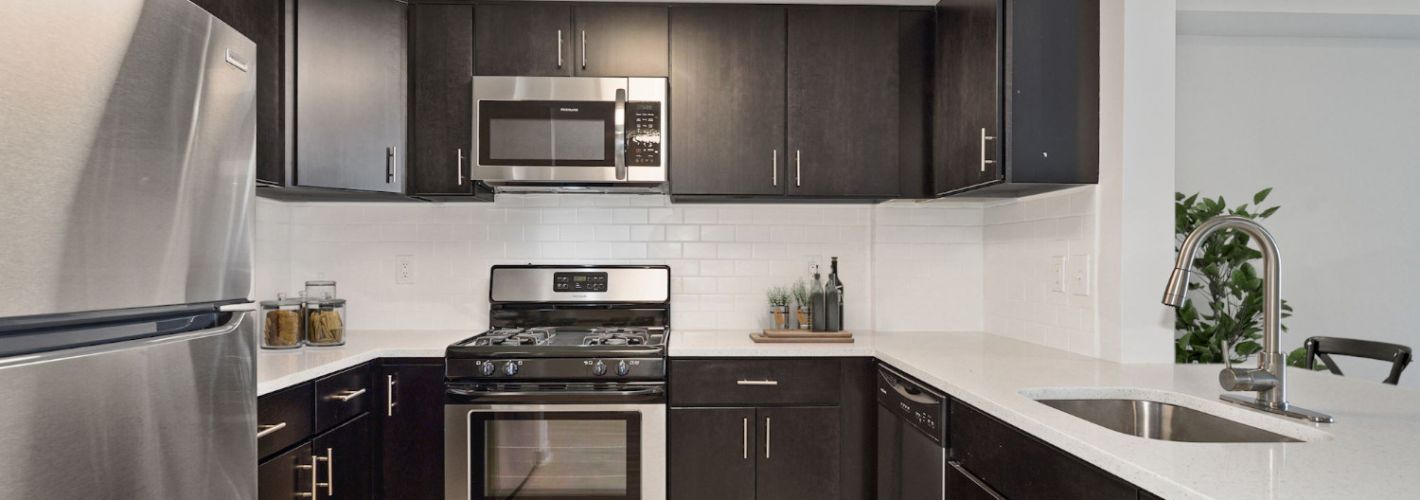 The Whitney : White quartz counters and dark espresso cabinets create an elegant juxtaposition