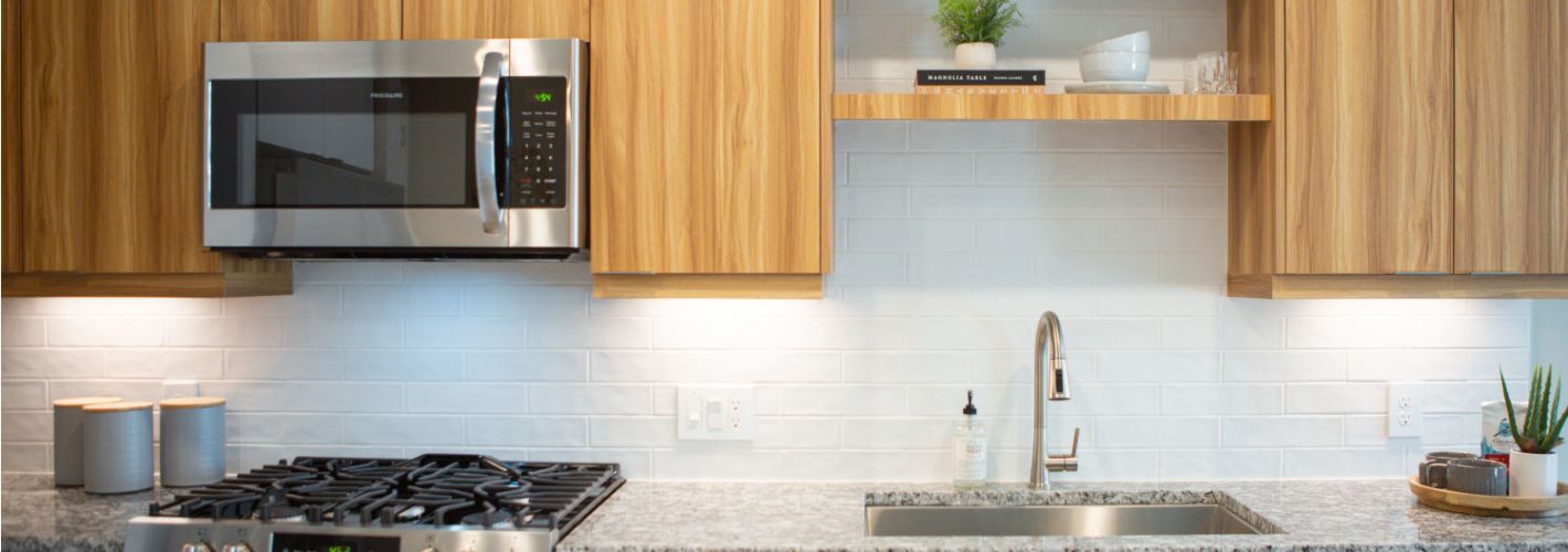Alexan Summerhill : Kitchens featuring modern backsplash.