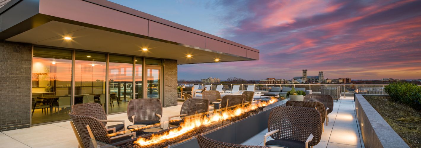 City Ridge : Enjoy the rooftop entertainment suite over the warmth of the outdoor fireplace