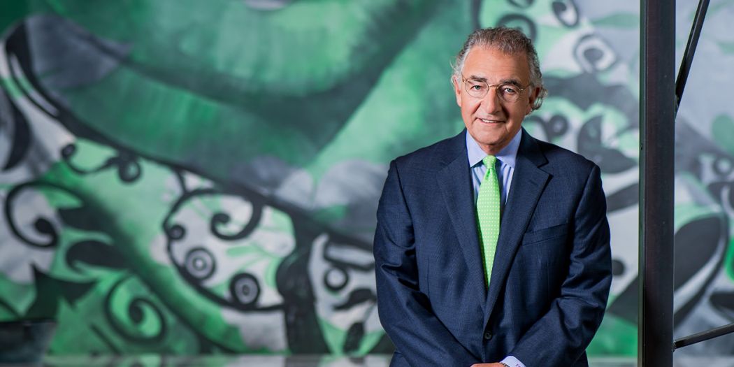 Tom Bozzuto, Bozzuto Group President & CEO, standing in front of a mural.