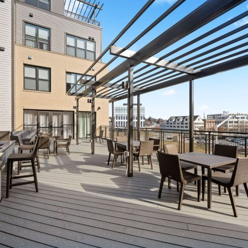 Rooftop lounge with fire pit and grills