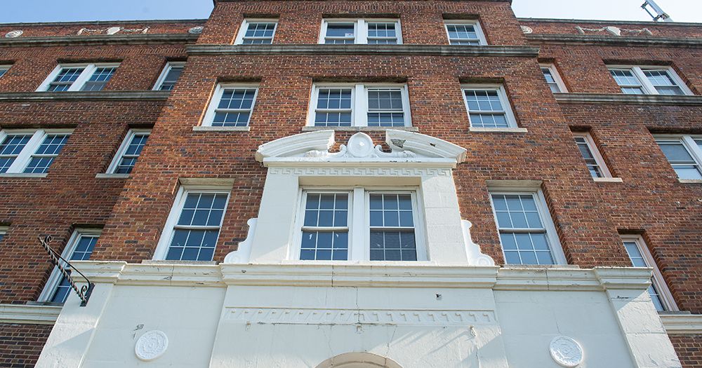 The Lexington luxury apartment in Washington, DC, showcasing facade with brick walls & windows.