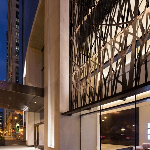 Controlled-access parking garage with EV charging stations is professionally managed for security and ease. 