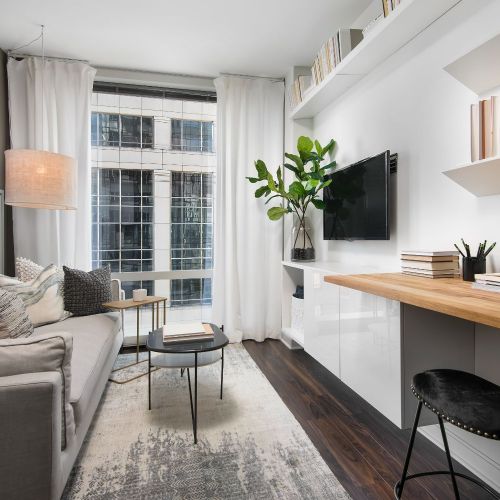 Open apartment layouts discreetly hide spacious, customized closets with built-in organizers.