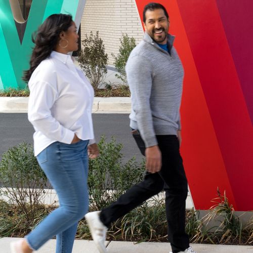 Take a stroll beneath our colorful amenity bridge