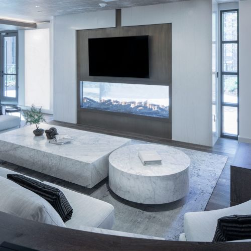 Clubroom showing lounge and TV above fireplace	