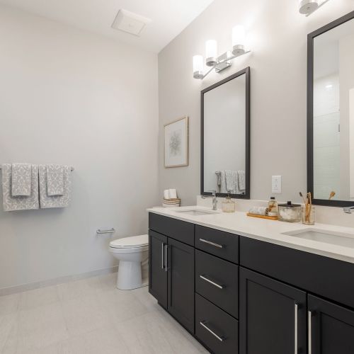 Large bathrooms with dual vanity sinks and walk-in shower