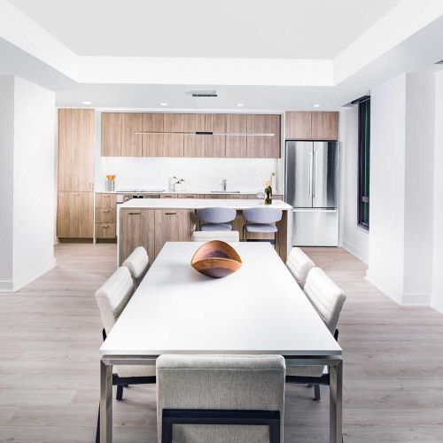 Wide, wood-laminate flooring throughout