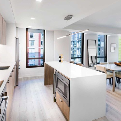 Upscale kitchens complete with expansive islands, built-in dual wall ovens and select wine refrigerators