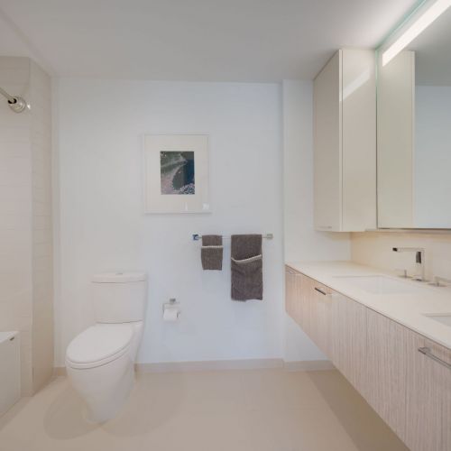 Bathrooms featuring large soaking tubs and glass enclosed showers