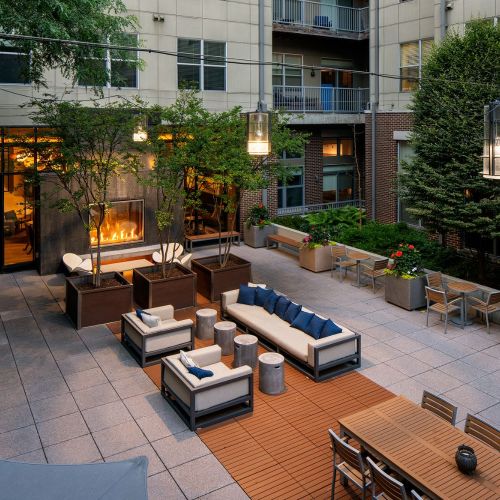 Escape to the zen outdoor courtyard featuring a crackling fire pit