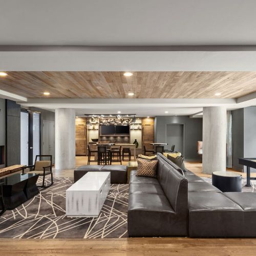 Large-scale fireplaces and whimsical furniture set a warm tone