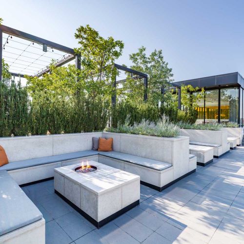 Intimate rooftop fireplace lounges to gather and connect