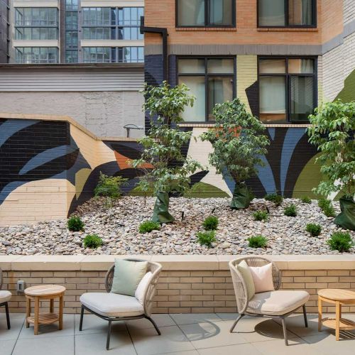 Serene outdoor courtyard featuring water-efficient landscaping 