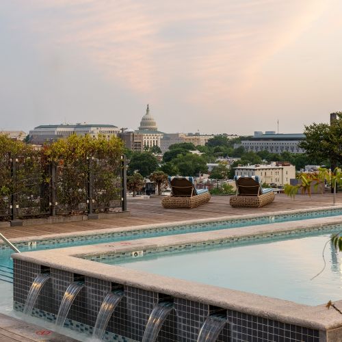 Soak up the sun and take a refreshing dip in our stunning rooftop pool with breathtaking city views