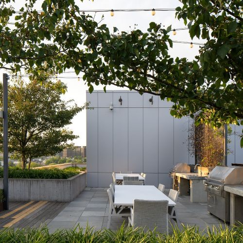 Elevate your BBQ game with stunning city views at our rooftop grill area