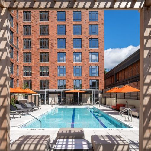 Heated pool with shaded pergolas