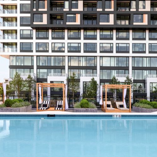 Unwind poolside with luxurious beach beds and cabanas