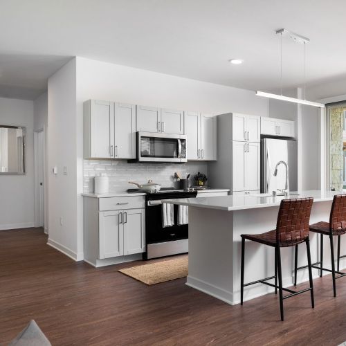 Wood plank floors enhance the apartments' clean, modernist style.