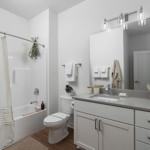 Spa-inspired bathrooms boast sleek finishes and ample storage.