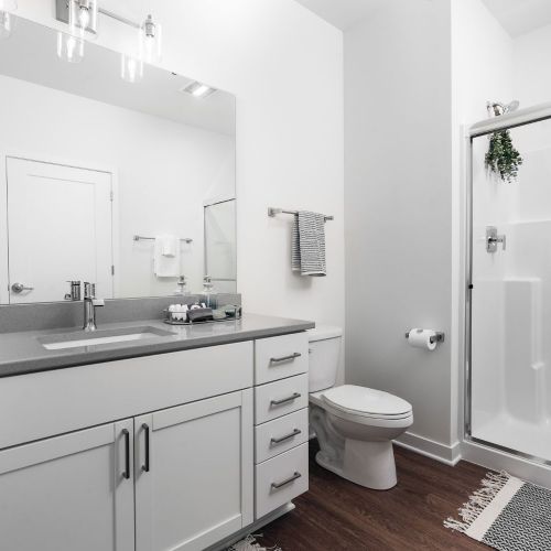Spa-inspired bathrooms boast sleek finishes and ample storage.