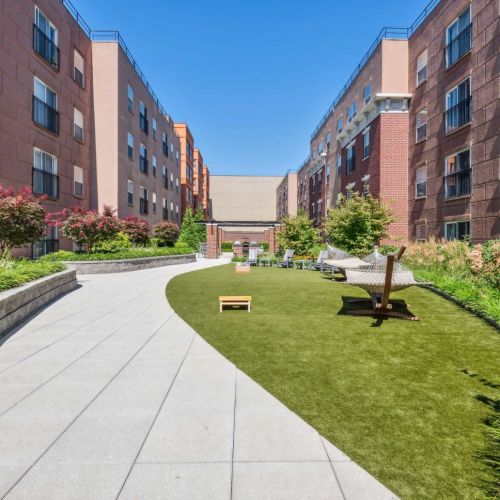Lawn hammock with cornhole games