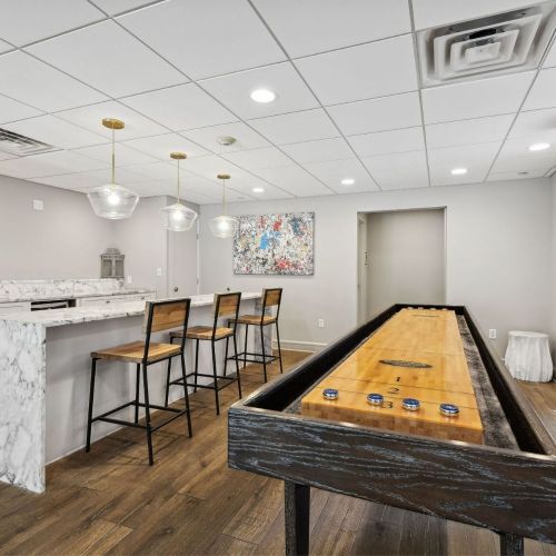 Resident community room with kitchen and shuffleboard
