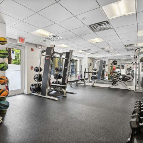 Fitness center featuring free weights + workout accessories 