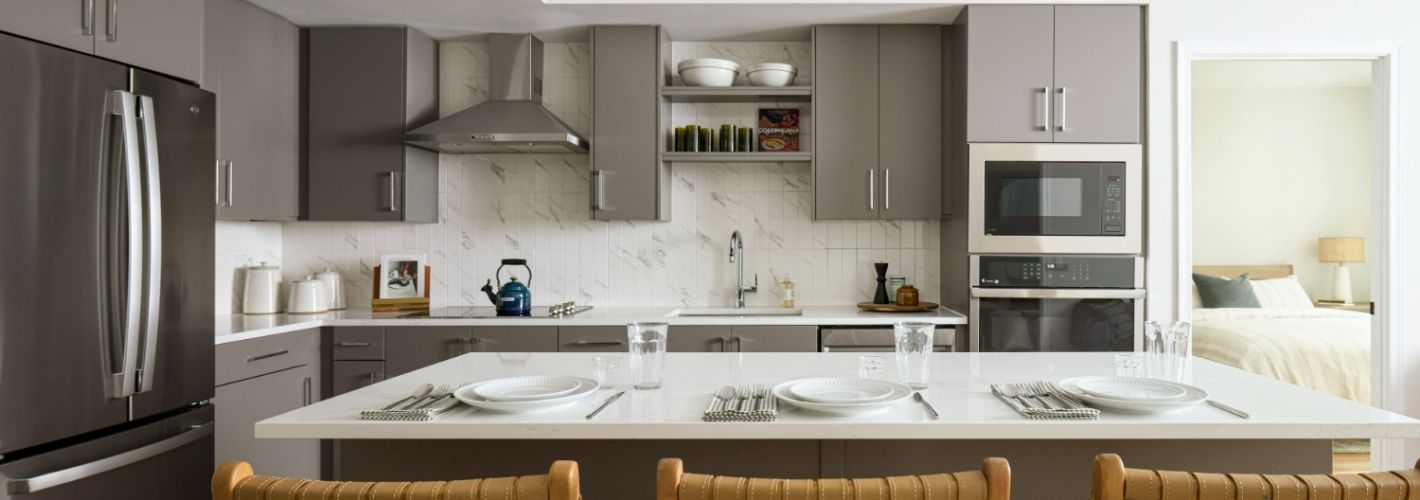 Alexan Fitzroy : Gather around the kitchen island, where you can create your next culinary masterpiece or host guests.