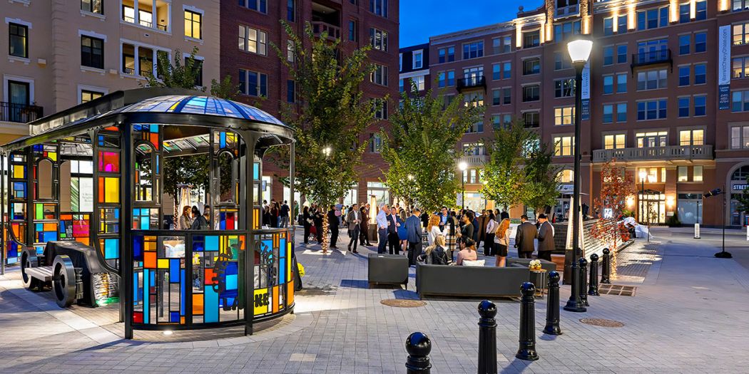 Vibrant common area of an apartment complex bustling with people.