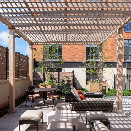 Resort-style pool deck with private pergolas