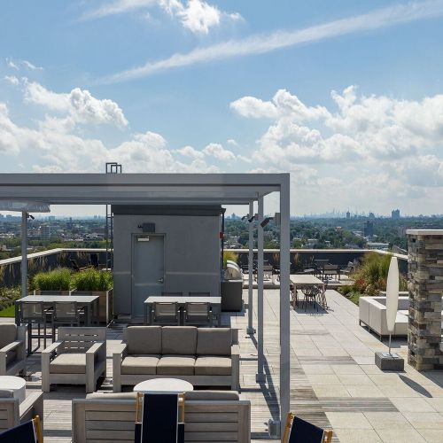 17th floor roof deck with outdoor kitchen and dining area 