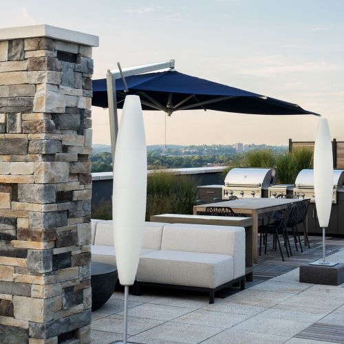 Roof deck with lounge area, dramatic fireplace, and city views