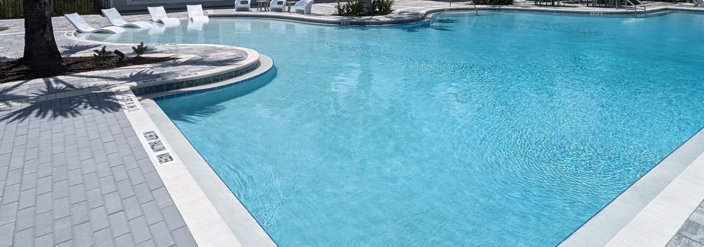 Avida : Avida's resort-style pool features an abundance of comfortable seating. *Images shown are for illustration purposes only and may not be an exact representation.
