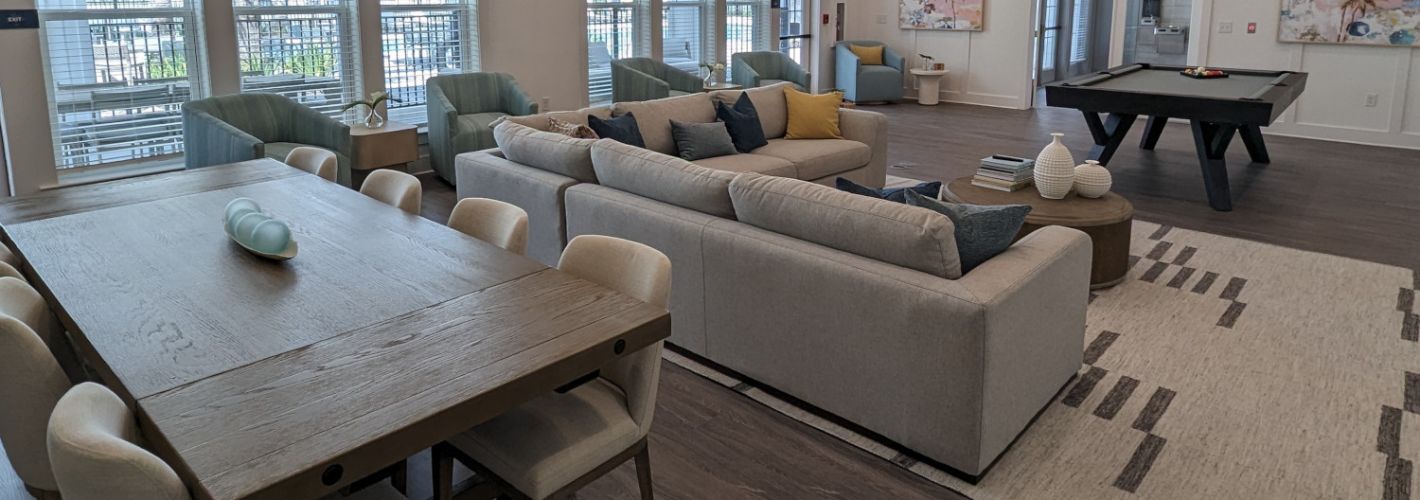 Avida : Entertain in the expansive clubroom, complete with a large flat screen TV, pool table, kitchen, and outdoor covered lanai with stunning views. *Images shown are for illustration purposes only and may not be an exact representation.