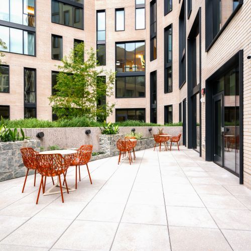 Third floor private garden with lounge seating and park views.