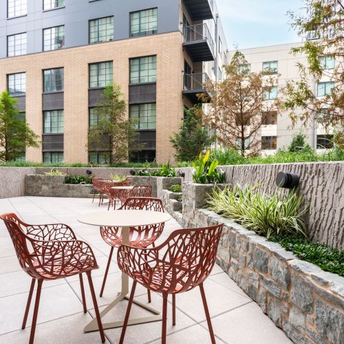 Third floor private garden with lounge seating and park views.