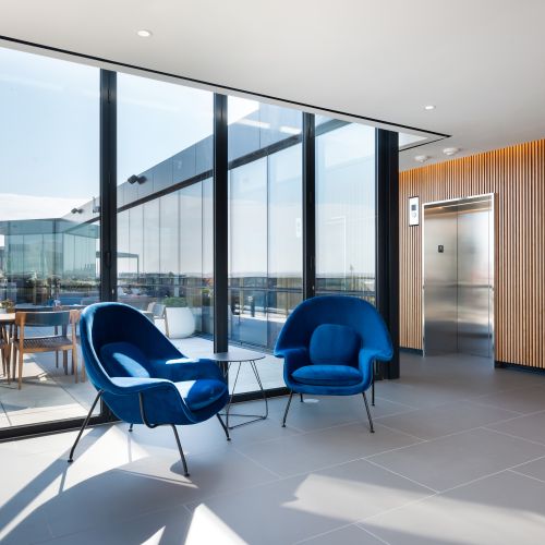 Rooftop lounge with ample seating.