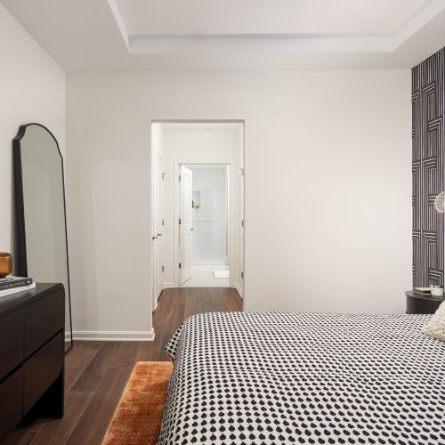 Bedrooms at The Claude offer comfortable living