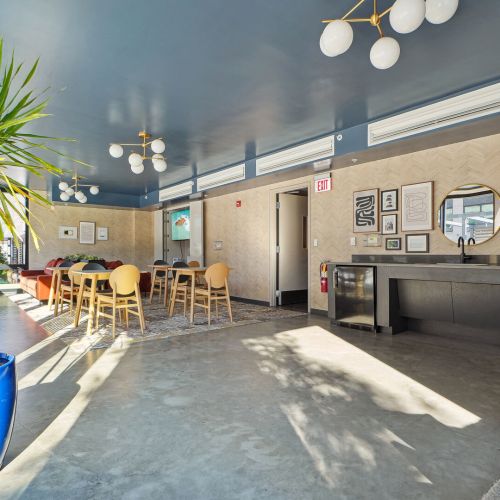 View of clubroom space including dining table 	