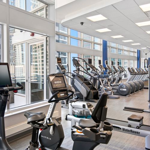 Close up of the fitness center's equipment including exercise bikes, rowing machine, stair machine, and ellipticals.