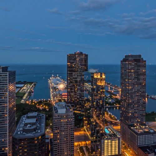 Wide angle of Atwater's east views at dusk capturing Navy Pier and Lake Michigan.
