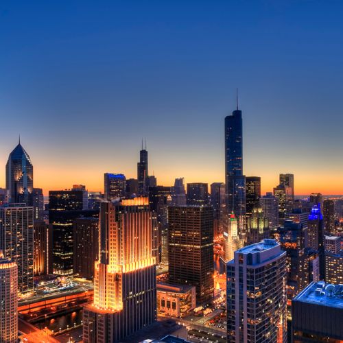 Wide sweeping view of the Chicago skyline and city lights from Atwater Apartments.