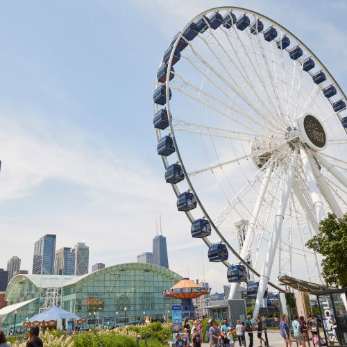 Wide angle of outdoor restaurant seating at Robert's Pizza and Dough Company along the Ogden Slip canal.