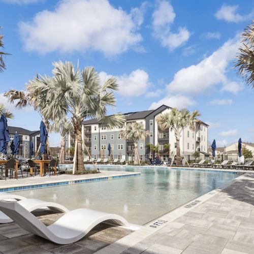 Avida : Avida's resort-style pool features an abundance of comfortable seating. 	