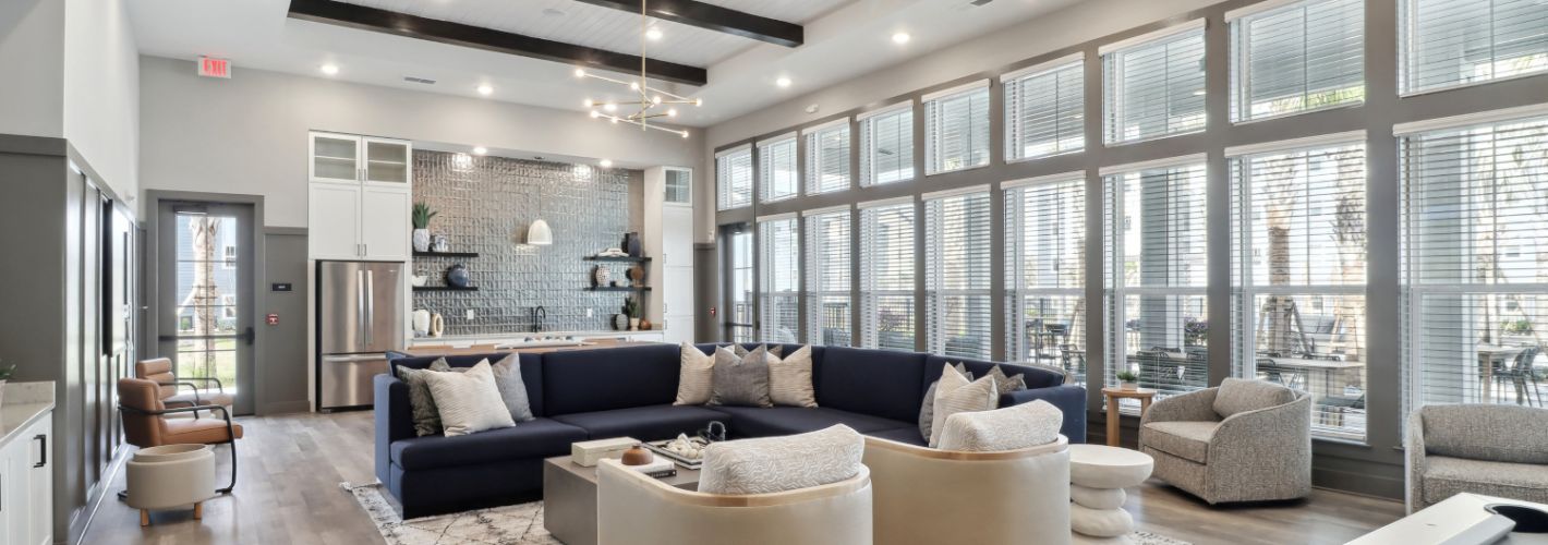 Avida : Entertain in the expansive clubroom, complete with a large flat screen TV, pool table, kitchen, and outdoor covered lanai with stunning views. 	