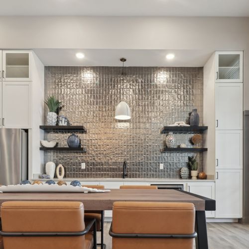 Entertain in the expansive clubroom, complete with a large flat screen TV, pool table, kitchen, and outdoor covered lanai with stunning views. 	